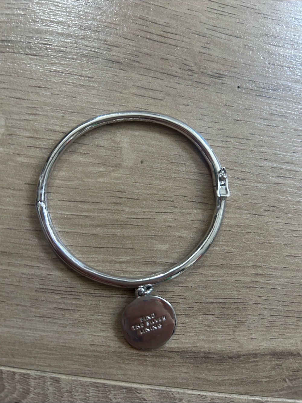 kate spade Silver-Tone Round Charm Bangle Bracelet “Find the silver lining”